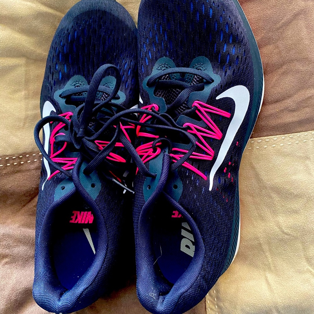 Nike brand tennis shoes. Size 10.5 women’s